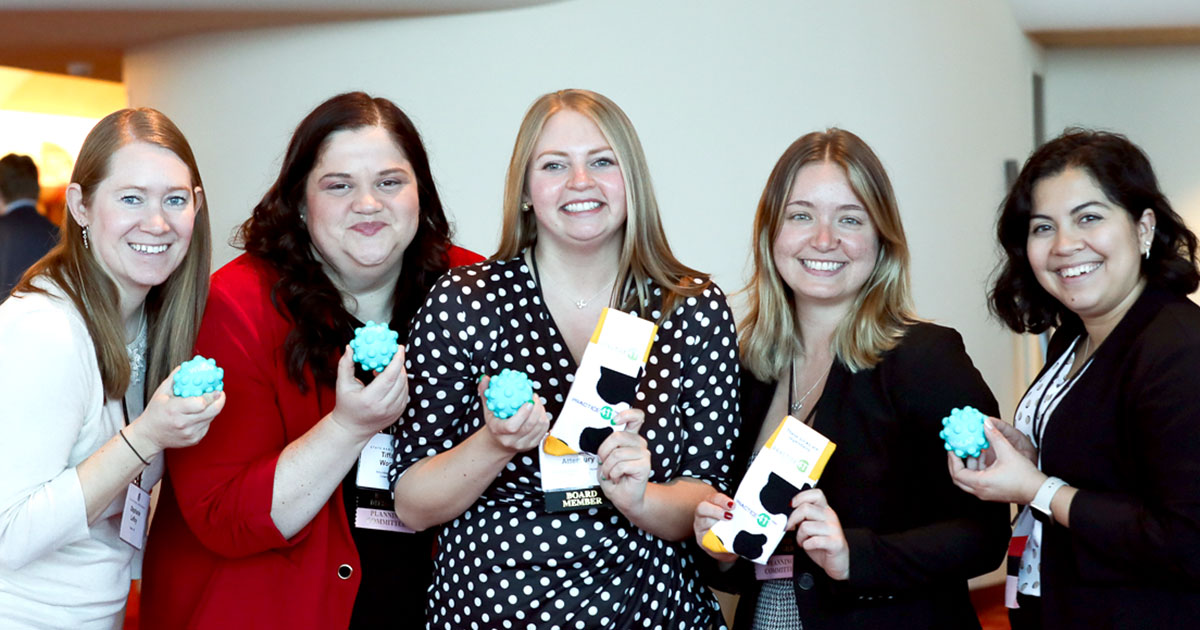 five women smiling at the camera