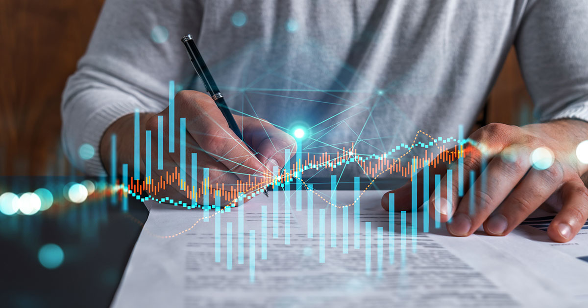 person signing a contract with bar graphs