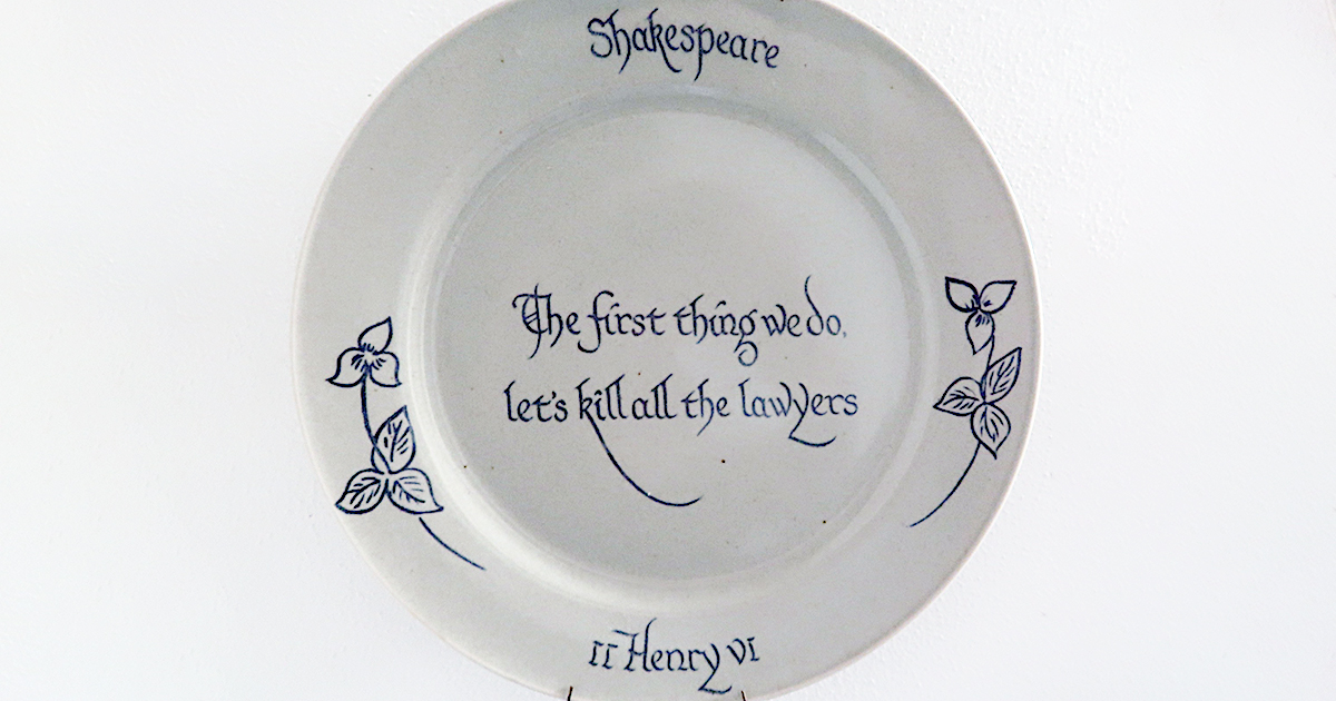 shows a plate with writing on it mounted on a wall