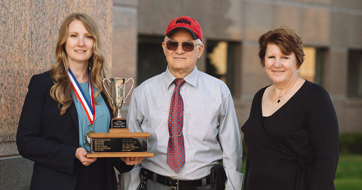 Margaret Kunisch (left), assistant D.A. for Dodge County, took the top prize at the Dodge County Bar Association’s 22nd annual Schuetzenfest. Judge Christine Snow (right) presented an award to Judge Joseph Sciascia (center), recognizing his many years promoting Schuetzenfest. Photo credit: Tatiana Shirasaki, Tati Photography. 