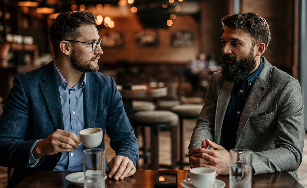 two business professionals at a coffee shop